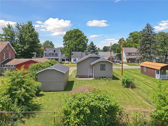 2602 Fletcher Ave NE, Canton, OH 44705 - fenced backyard featuring a shed and a residential view