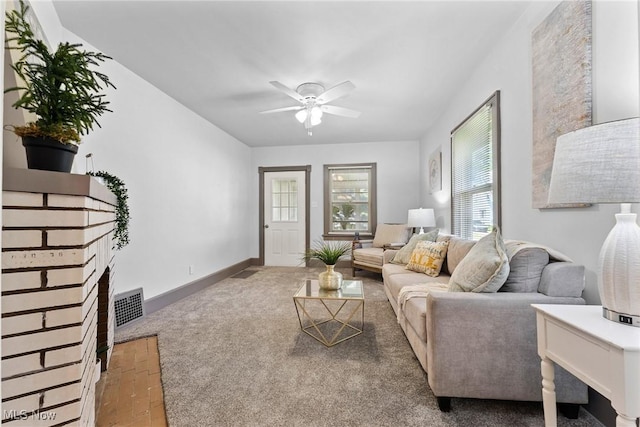 2602 Fletcher Ave NE, Canton, OH 44705 - living room featuring ceiling fan and a fireplace