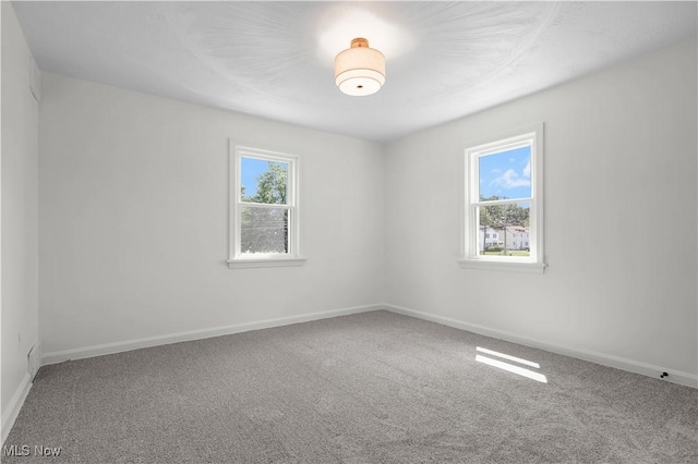 1146 Raff Rd SW, Canton, OH 44710 - carpeted empty room with baseboards