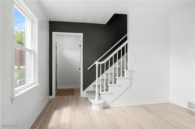 1146 Raff Rd SW, Canton, OH 44710 - foyer entrance featuring wood finished floors, plenty of natural light, and stairway