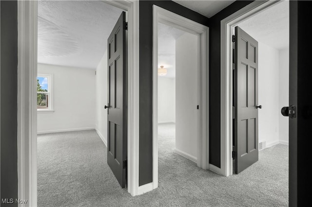 1146 Raff Rd SW, Canton, OH 44710 - corridor with carpet and a textured ceiling