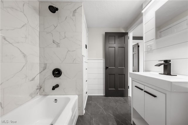 1146 Raff Rd SW, Canton, OH 44710 - bathroom featuring vanity, shower / bathtub combination, marble finish floors, and a textured ceiling