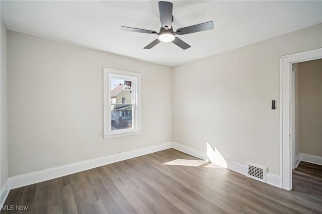 13713 Edgewood Ave, Cleveland, OH 44105 - spare room with wood finished floors and a ceiling fan