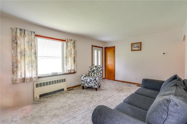 3985 Etter Rd, Mogadore, OH 44260 - carpeted living room featuring radiator and baseboards