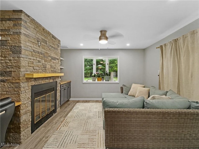 5265 Bellview St, Maple Heights, OH 44137 - living area featuring a fireplace, light wood-style floors, a ceiling fan, and recessed lighting