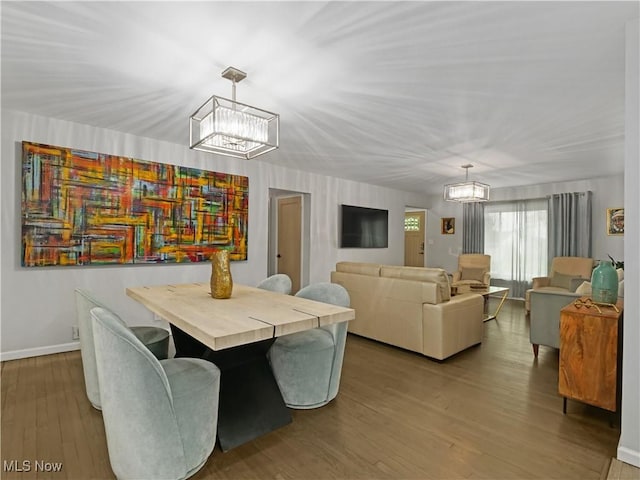 5265 Bellview St, Maple Heights, OH 44137 - dining space with a chandelier and wood finished floors
