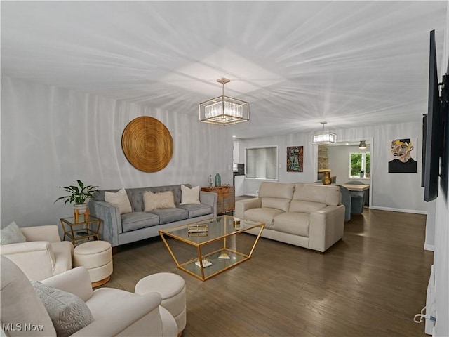 5265 Bellview St, Maple Heights, OH 44137 - living room featuring a chandelier and dark wood-style flooring