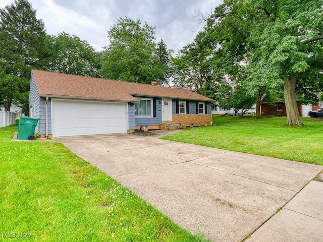 5265 Bellview St, Maple Heights, OH 44137 - view of front facade with driveway, an attached garage, and a front yard