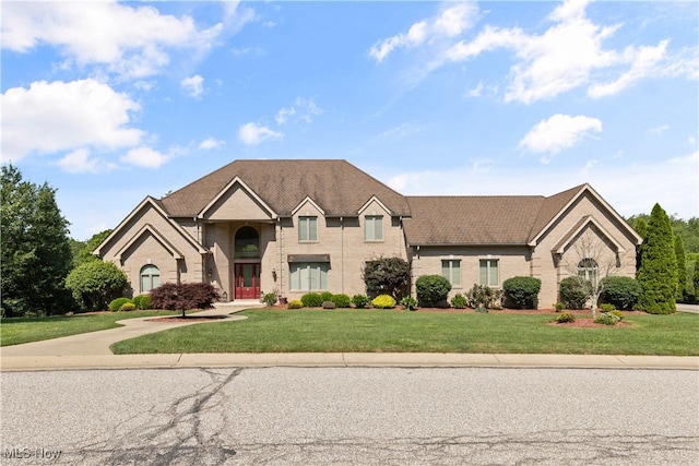 112 Caraplace, Wintersville, OH 43953 - traditional-style home with a front lawn and brick siding