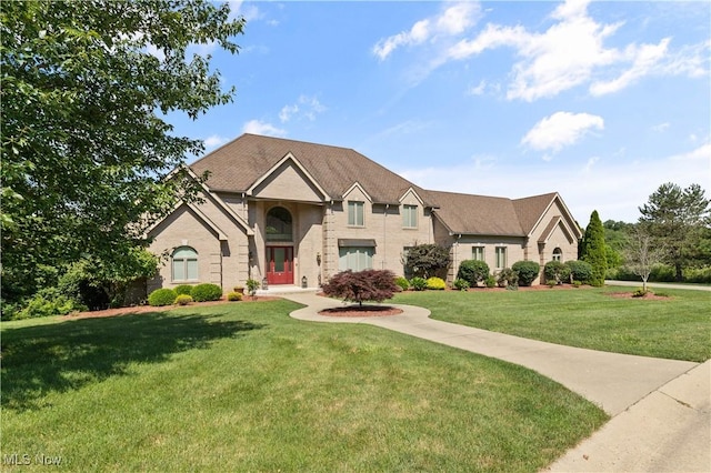 112 Caraplace, Wintersville, OH 43953 - view of front of property featuring a front yard and brick siding