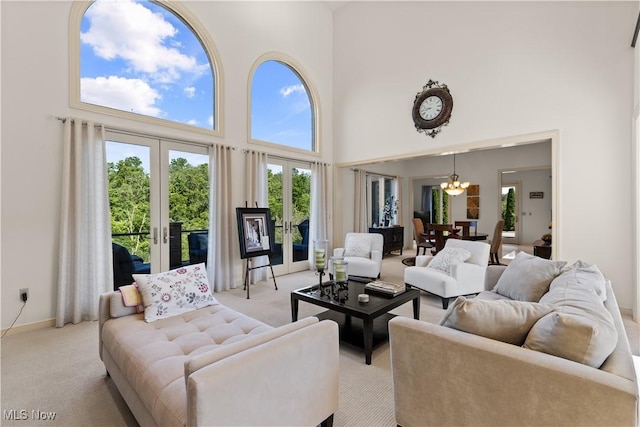 112 Caraplace, Wintersville, OH 43953 - living area with a high ceiling, french doors, light colored carpet, and a chandelier