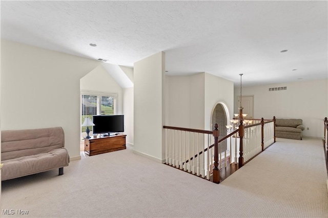 112 Caraplace, Wintersville, OH 43953 - sitting room featuring an upstairs landing, carpet floors, and a chandelier
