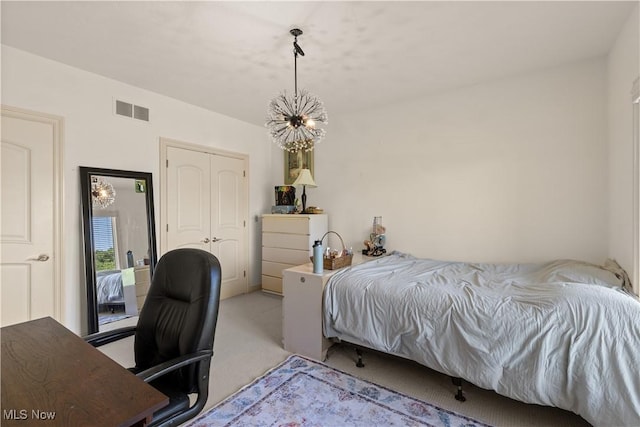 112 Caraplace, Wintersville, OH 43953 - bedroom with light colored carpet, an office area, a chandelier, and a closet