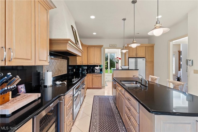 112 Caraplace, Wintersville, OH 43953 - kitchen featuring beverage cooler, freestanding refrigerator, a kitchen island with sink, light brown cabinets, and dark countertops