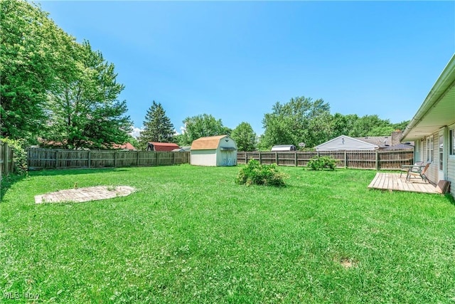 5149 Langfitt St, Vermilion, OH 44089 - fenced backyard featuring a storage unit and a deck