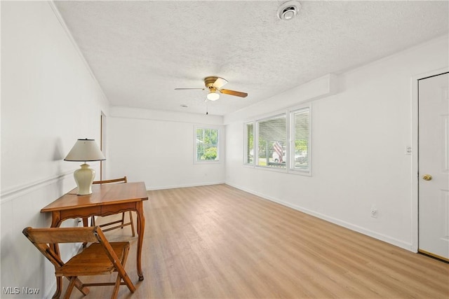 5149 Langfitt St, Vermilion, OH 44089 - sitting room featuring a textured ceiling, a ceiling fan, and light wood finished floors