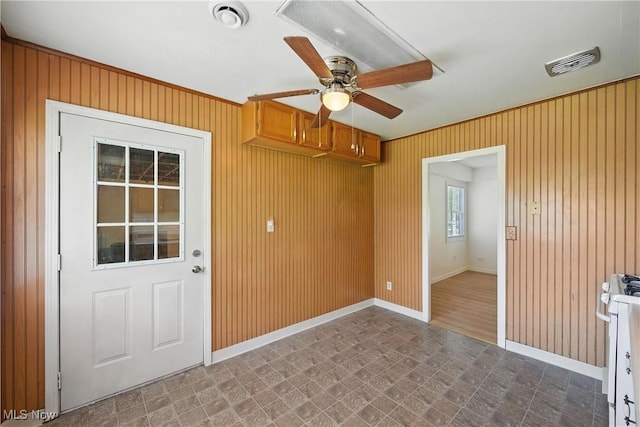 5149 Langfitt St, Vermilion, OH 44089 - empty room with a ceiling fan and wooden walls