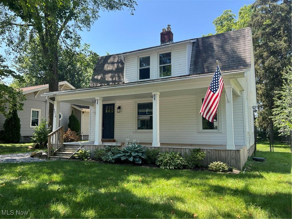 4476 Summit St, Willoughby, OH 44094 - view of front of property featuring covered porch, a chimney, and a front lawn