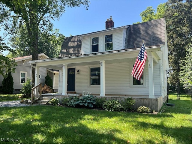 4476 Summit St, Willoughby, OH 44094 - view of front of property featuring covered porch, a chimney, and a front lawn
