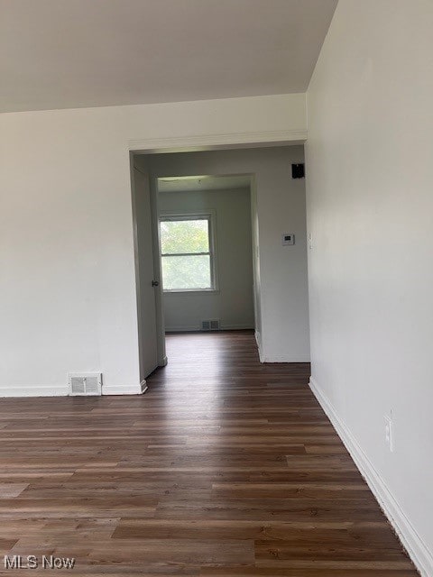 86 Fatima, Campbell, OH 44405 - spare room featuring dark wood-style flooring and baseboards