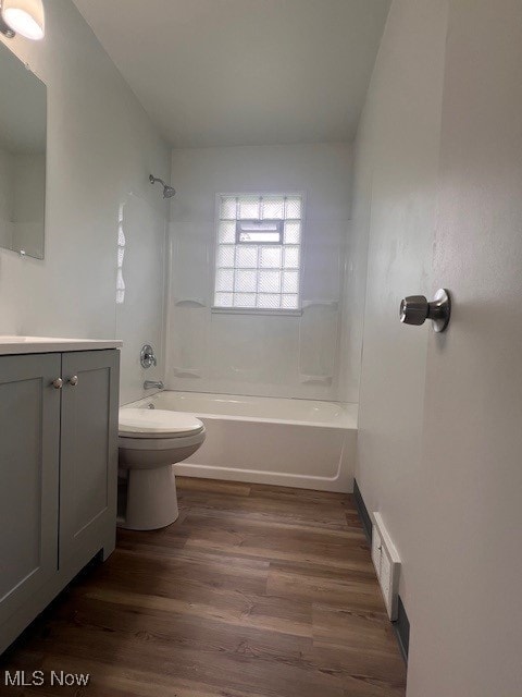 86 Fatima, Campbell, OH 44405 - bathroom featuring vanity, washtub / shower combination, and wood finished floors