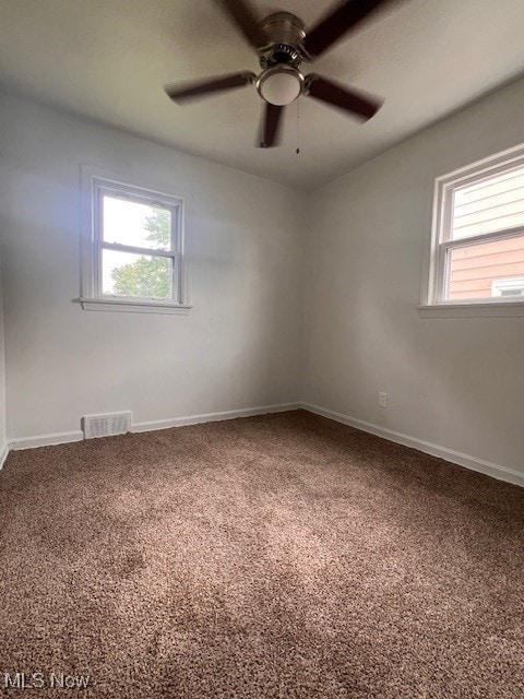 86 Fatima, Campbell, OH 44405 - carpeted empty room with a ceiling fan and baseboards