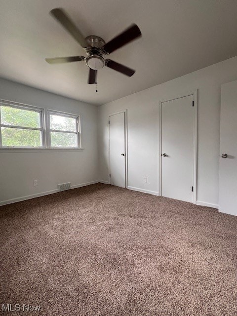 86 Fatima, Campbell, OH 44405 - unfurnished bedroom featuring carpet and ceiling fan