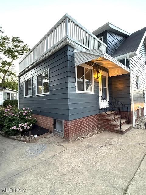 21430 Lakeshore Blvd, Euclid, OH 44123 - view of home's exterior with a balcony