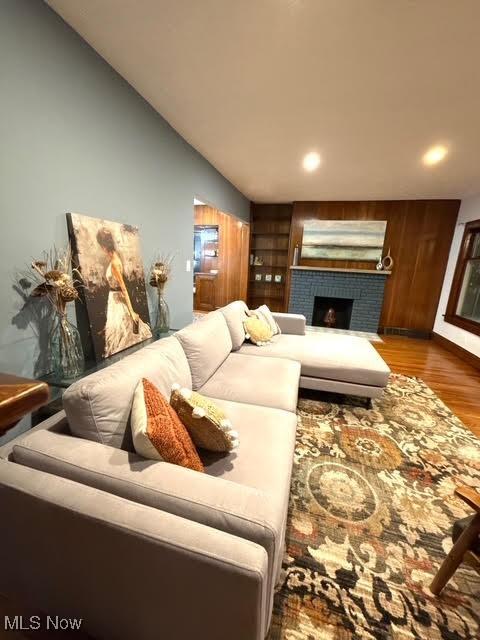 21430 Lakeshore Blvd, Euclid, OH 44123 - living room featuring wood finished floors, a fireplace, and recessed lighting
