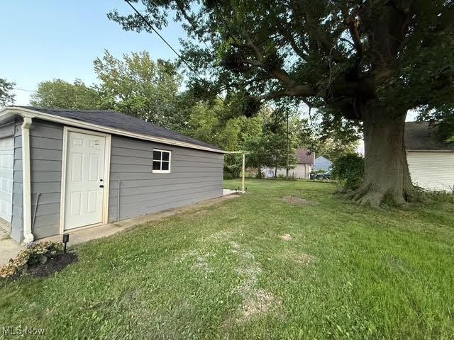 21430 Lakeshore Blvd, Euclid, OH 44123 - view of grassy yard featuring an outdoor structure