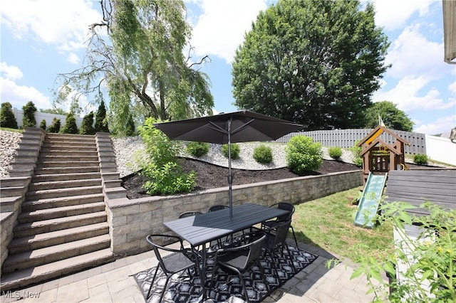 1524 Walker Rd, Follansbee, WV 26037 - fenced backyard featuring a playground, a patio area, outdoor dining space, and stairs