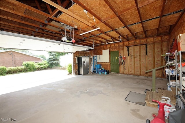 1524 Walker Rd, Follansbee, WV 26037 - garage featuring stainless steel fridge with ice dispenser and a garage door opener