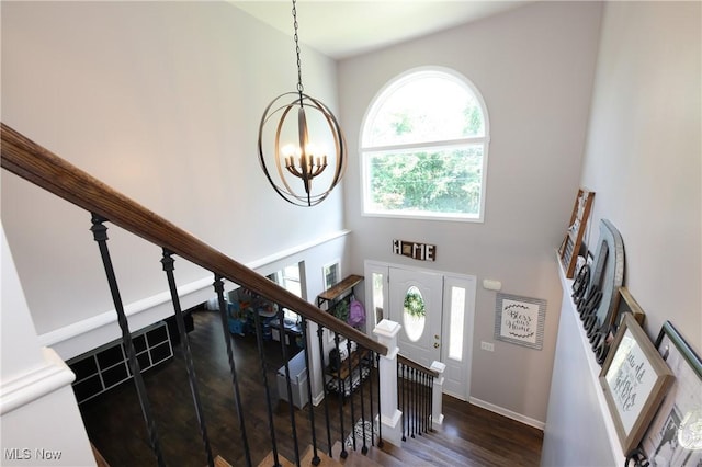 1524 Walker Rd, Follansbee, WV 26037 - stairs with wood finished floors, a chandelier, and a high ceiling