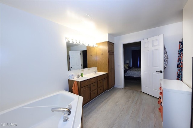 1524 Walker Rd, Follansbee, WV 26037 - full bathroom featuring a bath, wood finished floors, vanity, and ensuite bath