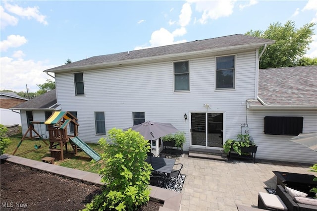1524 Walker Rd, Follansbee, WV 26037 - back of property featuring a patio area, a playground, and a shingled roof