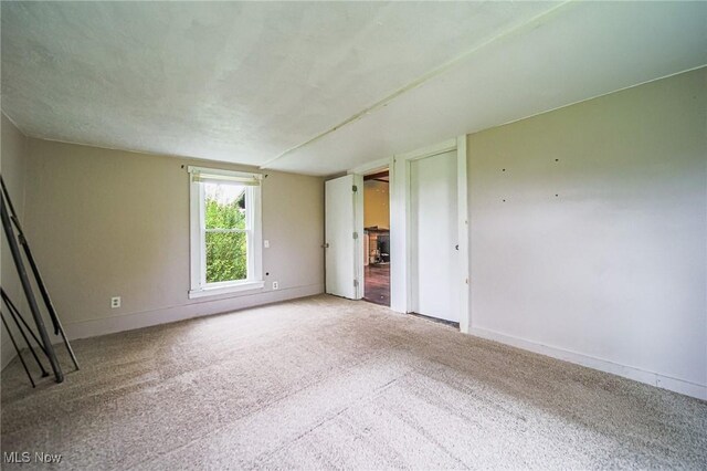 2461 Peters Creek Rd, Cambridge, OH 43725 - carpeted spare room featuring baseboards