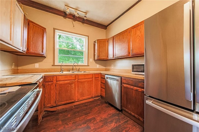 2461 Peters Creek Rd, Cambridge, OH 43725 - kitchen featuring stainless steel appliances, light countertops, dark wood-style floors, and brown cabinets