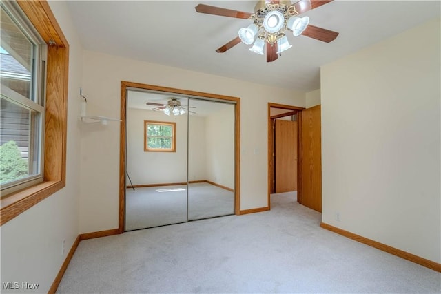114 Buckner Bend Rd, Walker, WV 26180 - unfurnished bedroom with carpet, a closet, and a ceiling fan