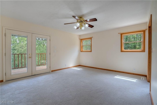 114 Buckner Bend Rd, Walker, WV 26180 - carpeted empty room with plenty of natural light, french doors, and ceiling fan