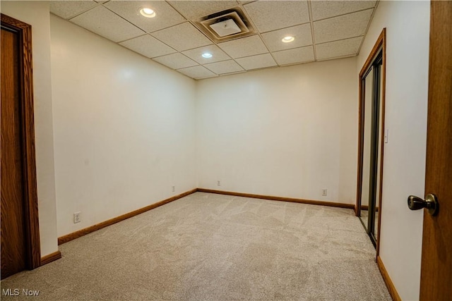 114 Buckner Bend Rd, Walker, WV 26180 - spare room with carpet floors, a paneled ceiling, and recessed lighting
