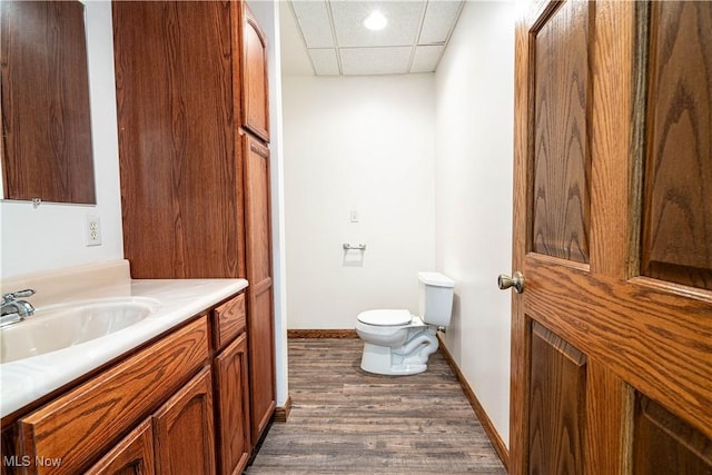 114 Buckner Bend Rd, Walker, WV 26180 - bathroom with vanity, wood finished floors, a paneled ceiling, and recessed lighting