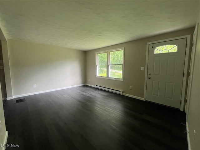 9420 Cedar Ct W, Nashport, OH 43830 - entryway featuring a baseboard heating unit, dark wood-style flooring, and a textured ceiling