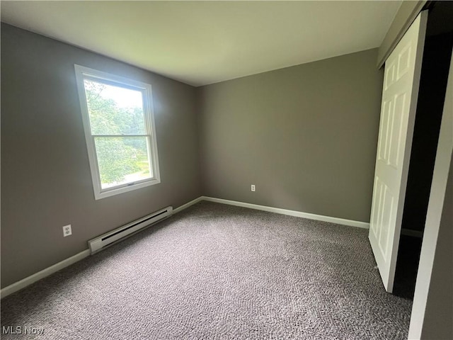 9420 Cedar Ct W, Nashport, OH 43830 - spare room with baseboard heating and carpet flooring
