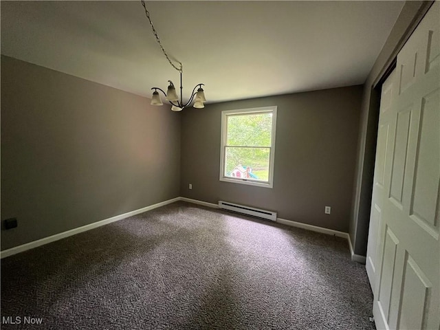 9420 Cedar Ct W, Nashport, OH 43830 - unfurnished room featuring a baseboard radiator, a chandelier, and carpet flooring