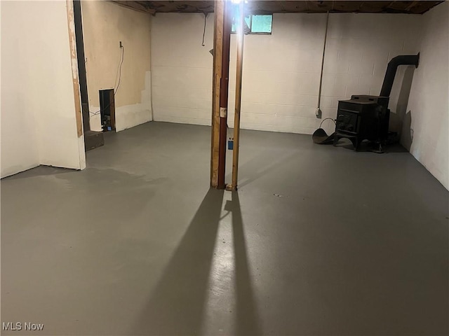 9420 Cedar Ct W, Nashport, OH 43830 - basement with a wood stove and concrete block wall