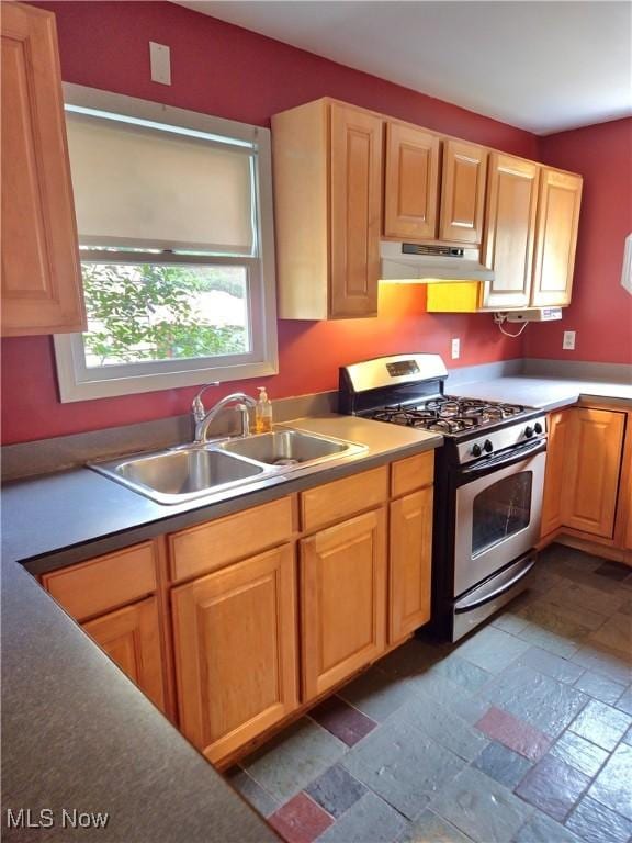 17405 Schenely Ave, Cleveland, OH 44119 - kitchen with stainless steel range with gas cooktop, under cabinet range hood, and stone tile flooring