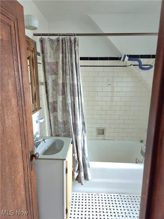 17405 Schenely Ave, Cleveland, OH 44119 - full bathroom featuring vanity and shower / bathtub combination with curtain