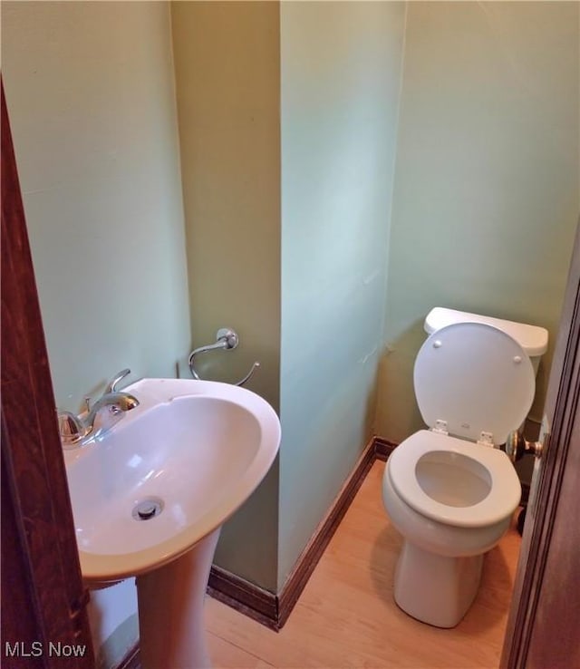 17405 Schenely Ave, Cleveland, OH 44119 - bathroom featuring wood finished floors and toilet