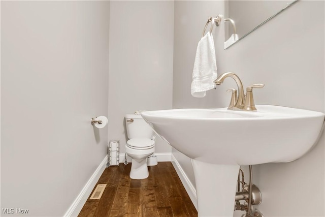 12110 Cora Ct, Concord, OH 44077 - half bathroom with toilet and wood finished floors