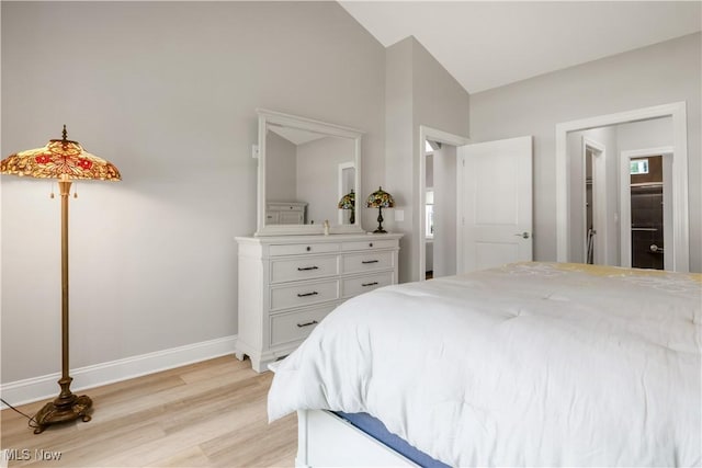 12110 Cora Ct, Concord, OH 44077 - bedroom with light wood-style flooring and lofted ceiling